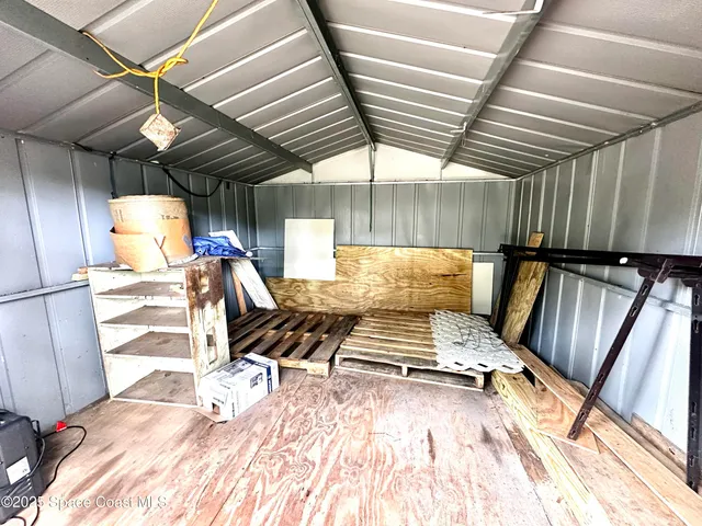 a view of kitchen with wooden floor