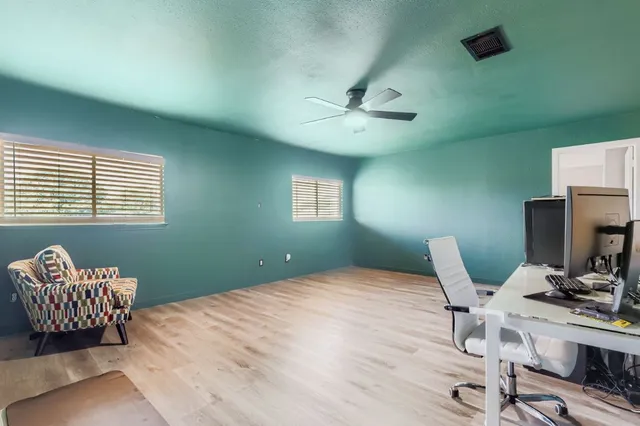 a bedroom with a bed and a chair