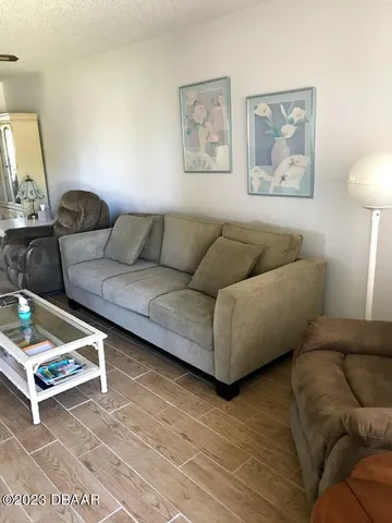 a living room with furniture and a window