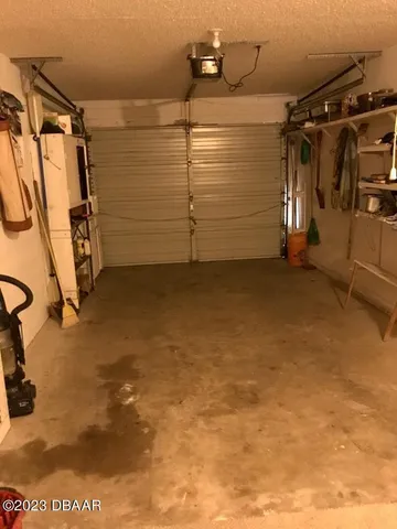 a view of walk in closet with clothes
