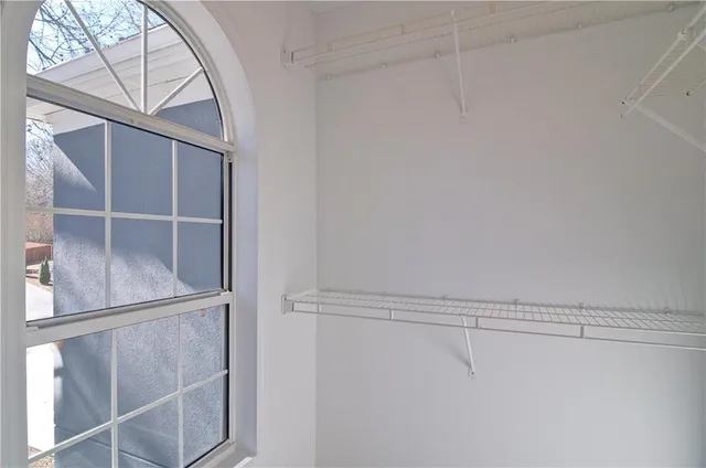 a white bath tub sitting next to a window