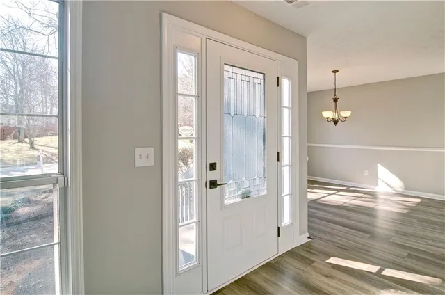 a view of entryway with wooden floor