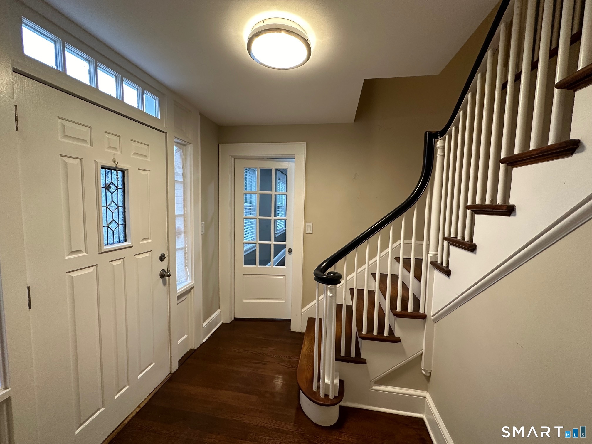 70 Hawthorne Street Bridgeport, CT 06610 - Photo 12 of 23 a view of entryway with wooden floor and stairs