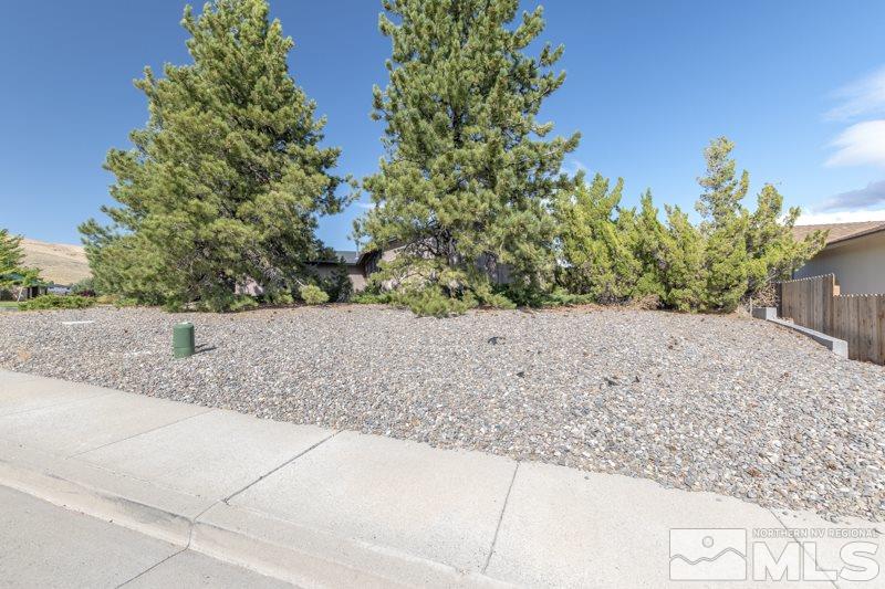 3937 Buckingham Square Reno, NV 89503 - Photo 18 of 18 a view of a dry yard with wooden fence