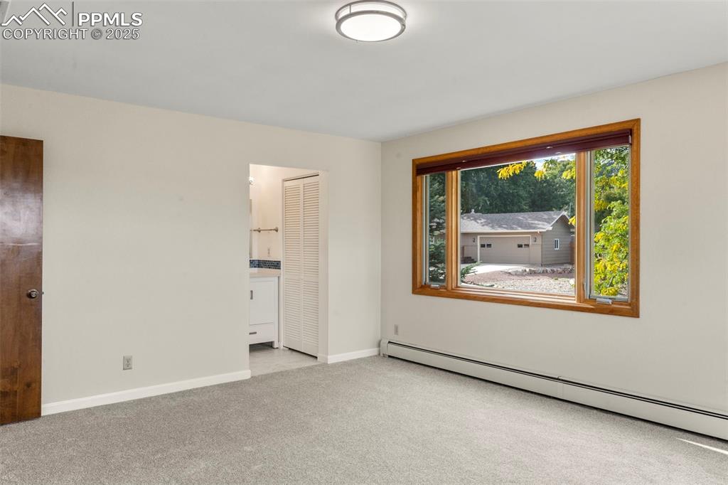 327 Clarksley Road Manitou Springs, CO 80829 - Photo 12 of 26 an empty room with a window