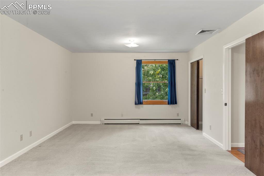 327 Clarksley Road Manitou Springs, CO 80829 - Photo 17 of 26 an empty room with windows