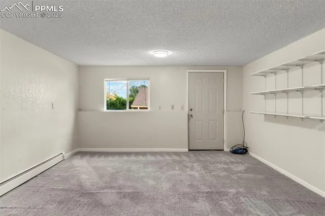 an empty room with closet area