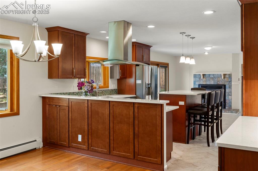 327 Clarksley Road Manitou Springs, CO 80829 - Photo 4 of 26 a kitchen with stainless steel appliances kitchen island granite countertop a refrigerator and a sink