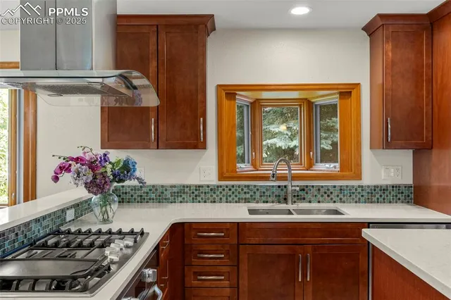 a kitchen with a sink and cabinets