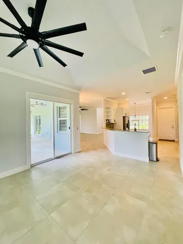 a kitchen with stainless steel appliances granite countertop a stove a sink dishwasher and a refrigerator