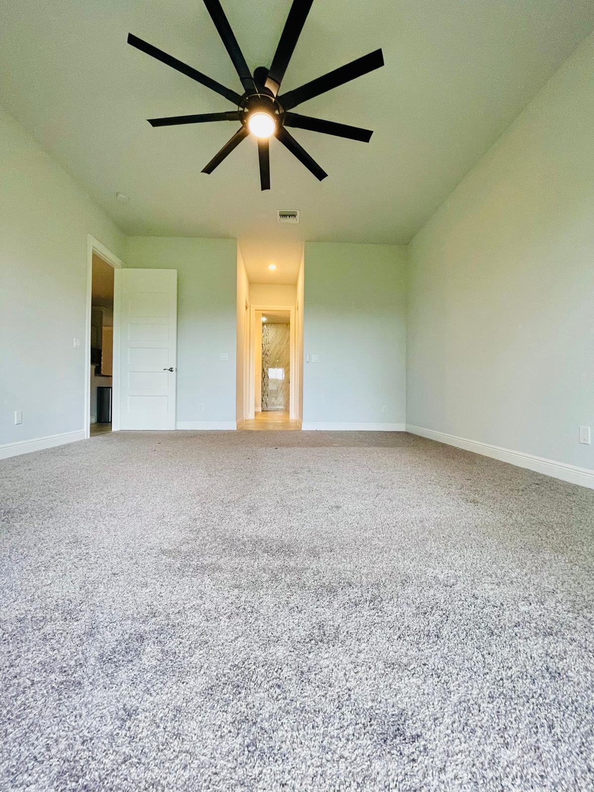 17225 78th Road North Loxahatchee, FL 33470 - Photo 17 of 93 an empty room with a ceiling fan and a window