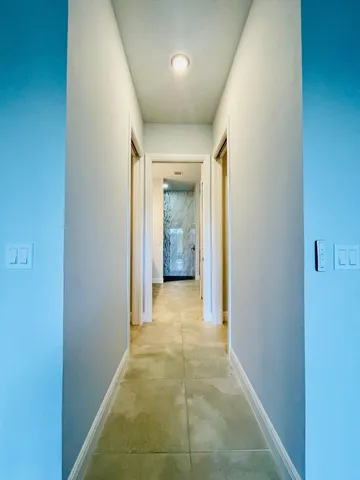 a bathroom with a tub shower and sink