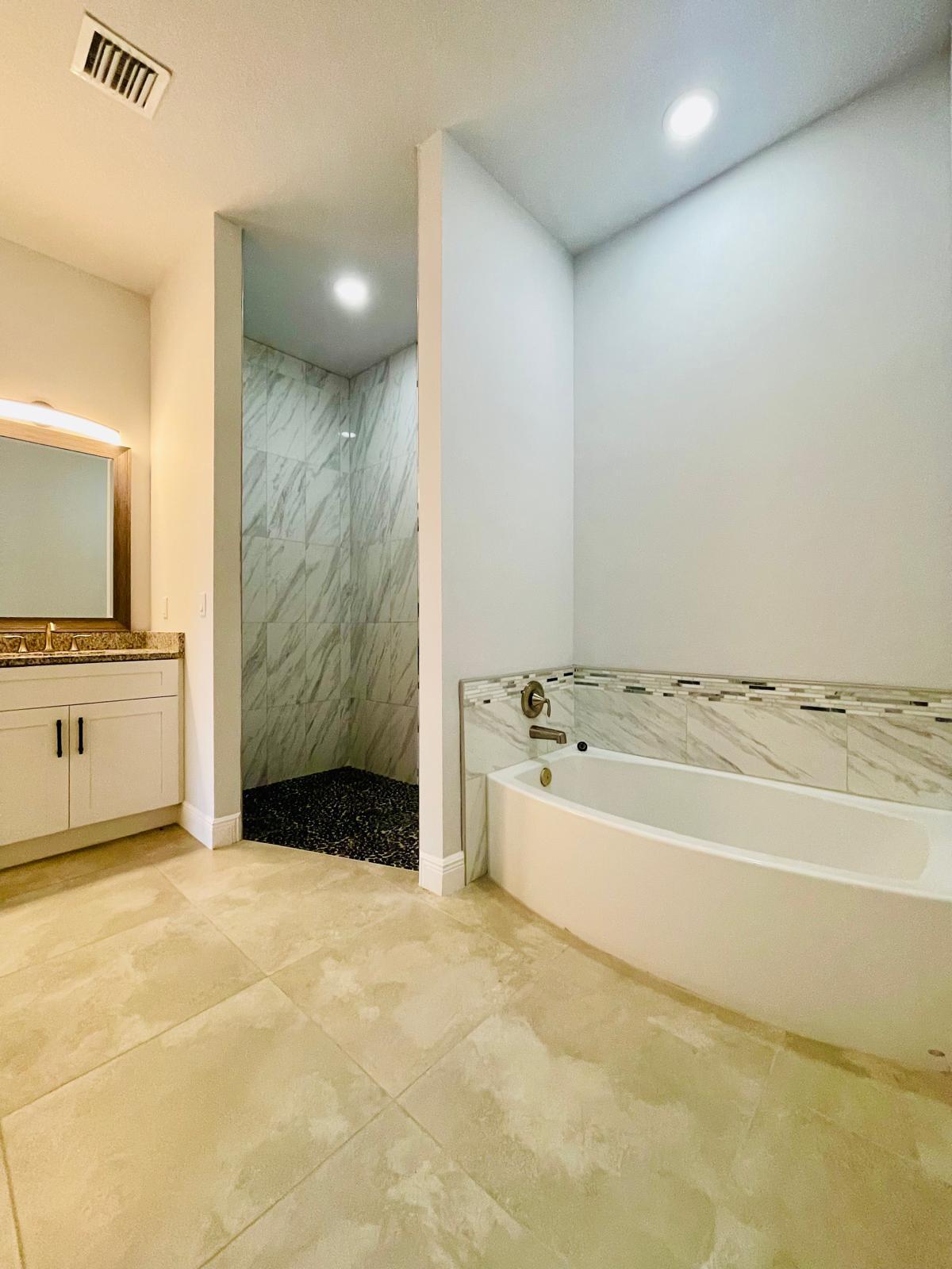 17225 78th Road North Loxahatchee, FL 33470 - Photo 20 of 93 a bathroom with a bathtub and a sink