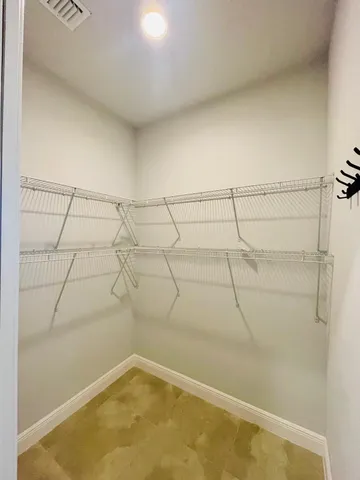 a kitchen with kitchen island granite countertop a sink stove and refrigerator