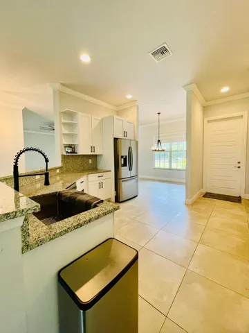 a view of a swimming pool with an outdoor space and seating area