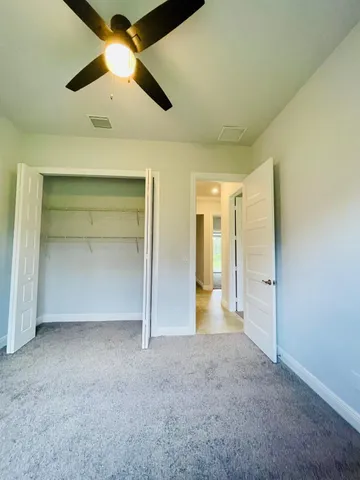 a view of a house with swimming pool and a yard