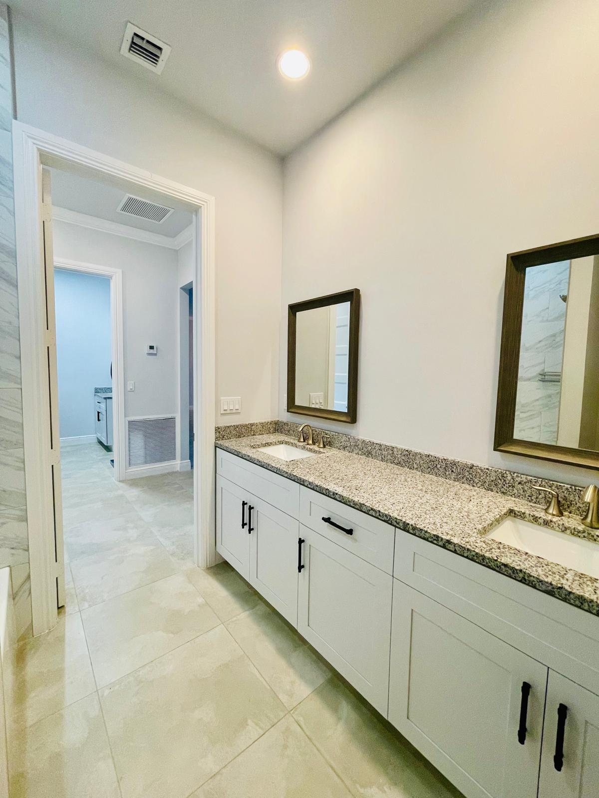 17225 78th Road North Loxahatchee, FL 33470 - Photo 54 of 93 a bathroom with a granite countertop sink and a mirror