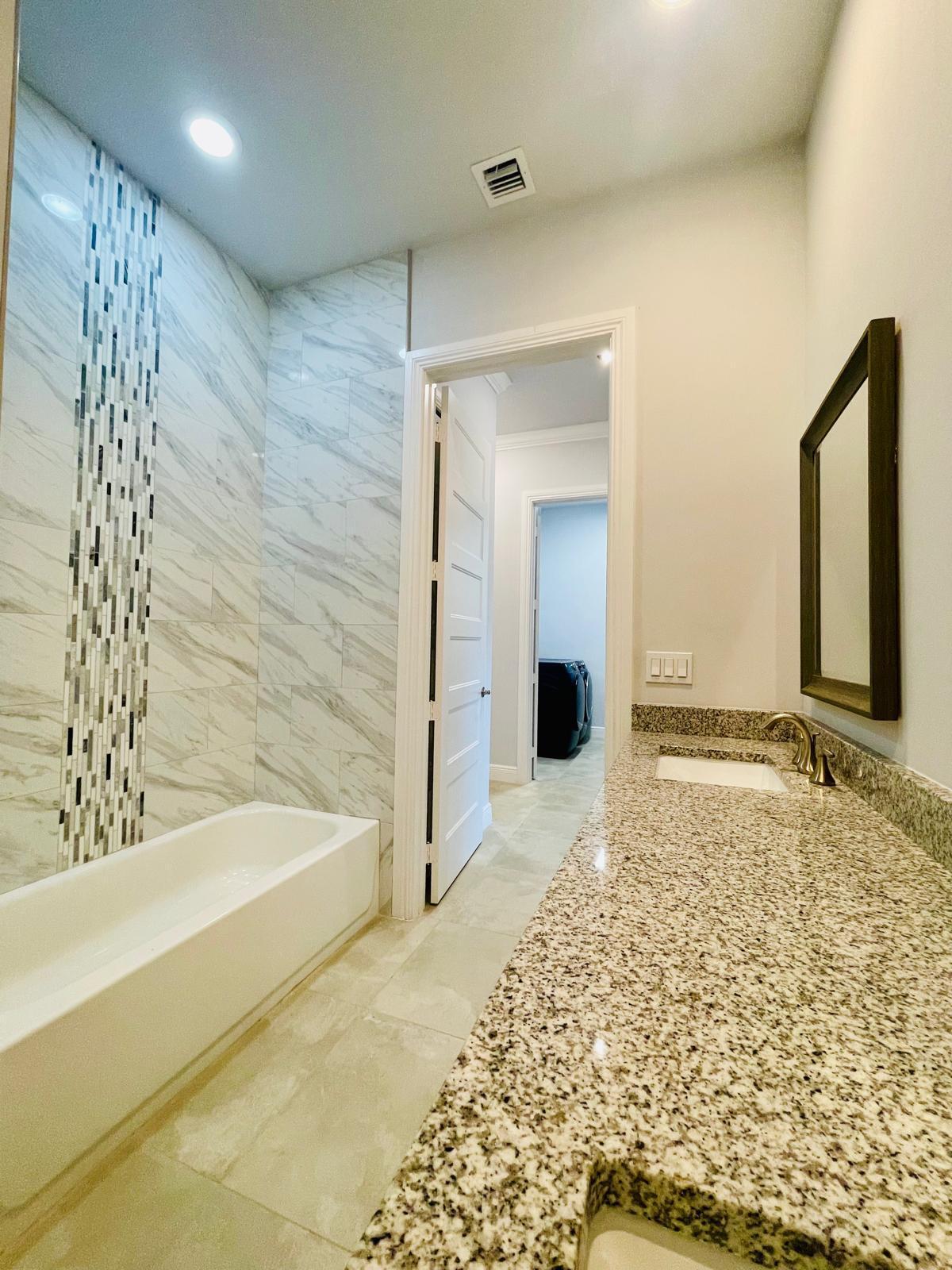 17225 78th Road North Loxahatchee, FL 33470 - Photo 55 of 93 a bathroom with a bathtub and shower