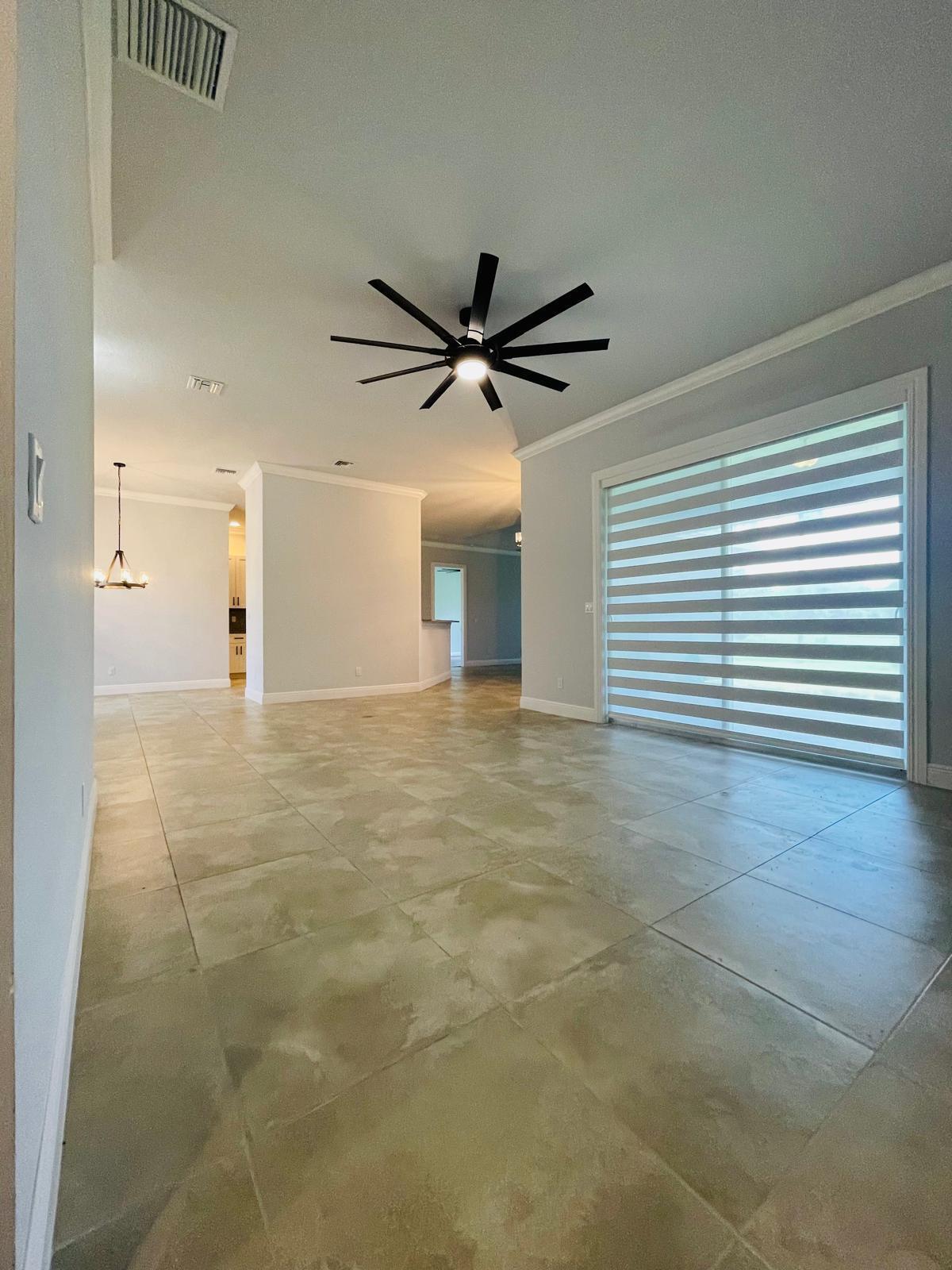 17225 78th Road North Loxahatchee, FL 33470 - Photo 71 of 93 a view of a livingroom with a ceiling fan and window