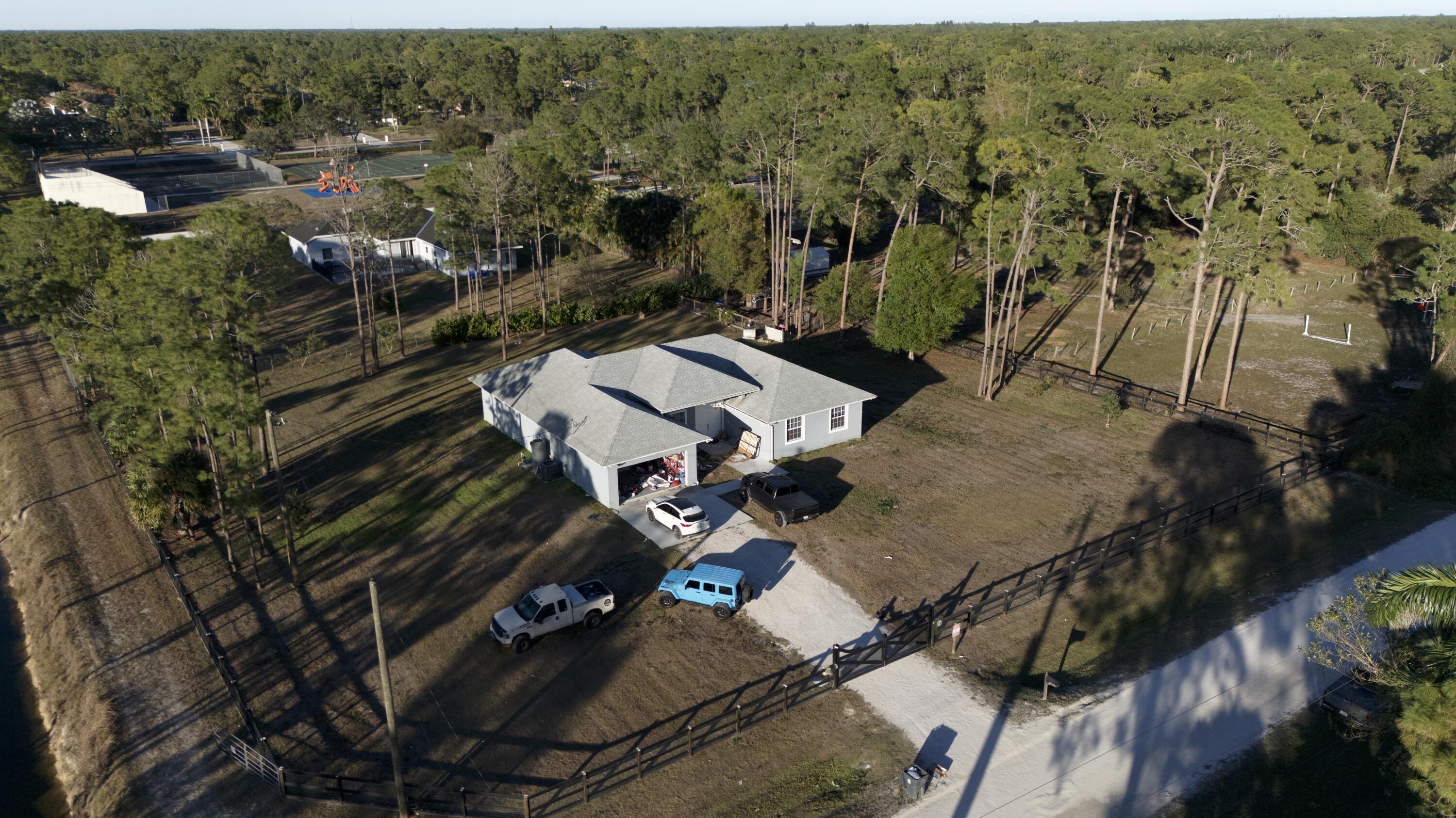 17225 78th Road North Loxahatchee, FL 33470 - Photo 88 of 93 an aerial view of a house with a yard