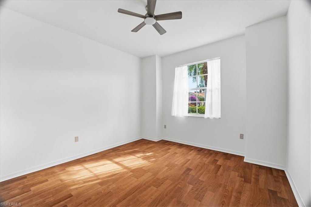14439 Manchester Drive Naples, FL 34114 - Photo 11 of 47 an empty room with a window