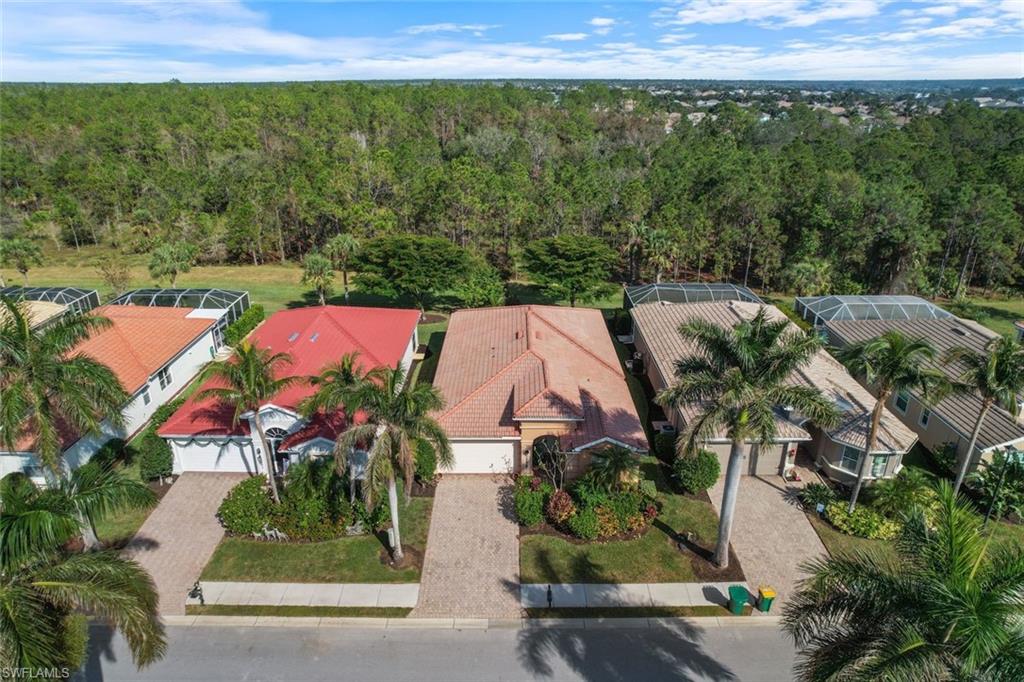 14439 Manchester Drive Naples, FL 34114 - Photo 19 of 47 an aerial view of residential houses with outdoor space and street view