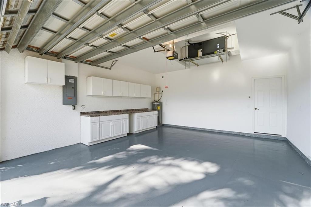 14439 Manchester Drive Naples, FL 34114 - Photo 21 of 47 a view of a garage