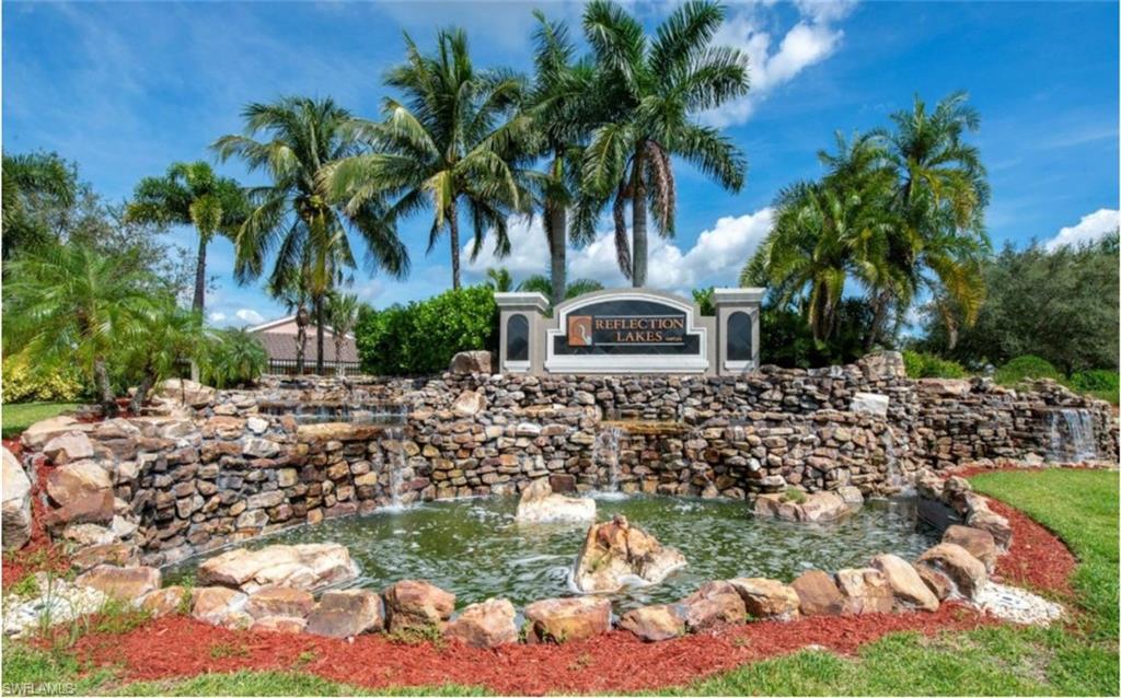 14439 Manchester Drive Naples, FL 34114 - Photo 22 of 47 a view of a yard with a fountain
