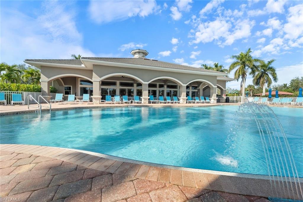 14439 Manchester Drive Naples, FL 34114 - Photo 25 of 47 a front view of a house with garden