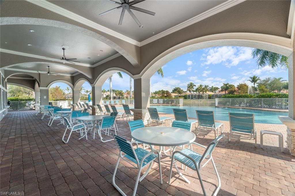 14439 Manchester Drive Naples, FL 34114 - Photo 26 of 47 a view of a dining room with furniture one side kitchen view and wooden floor