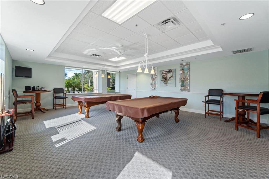 14439 Manchester Drive Naples, FL 34114 - Photo 28 of 47 a living room with furniture a pool table and a large window