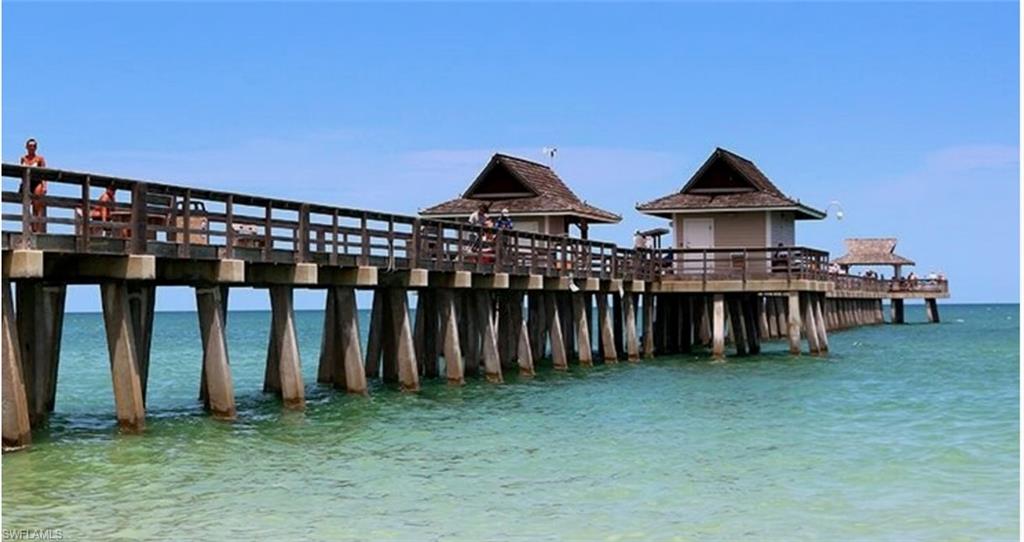 14439 Manchester Drive Naples, FL 34114 - Photo 35 of 47 a view of a house with wooden deck and a yard