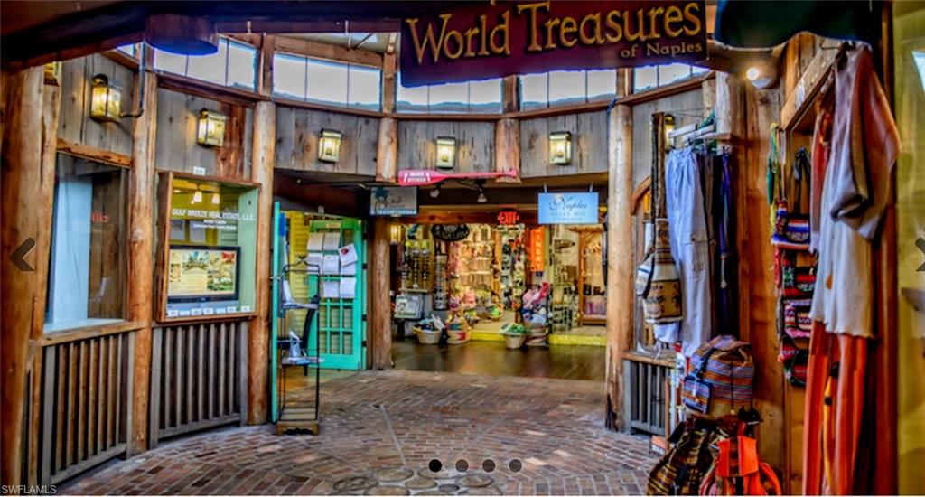 14439 Manchester Drive Naples, FL 34114 - Photo 40 of 47 a view of shops on a street