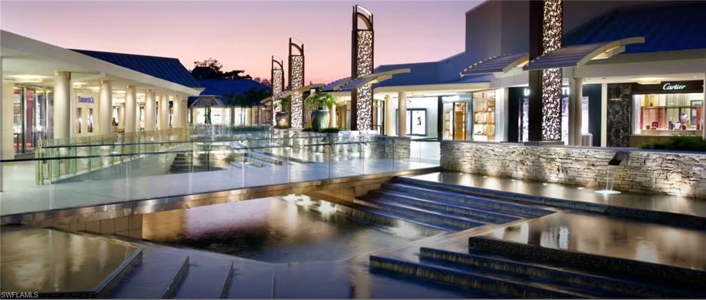 14439 Manchester Drive Naples, FL 34114 - Photo 43 of 47 a view of swimming pool with outdoor seating