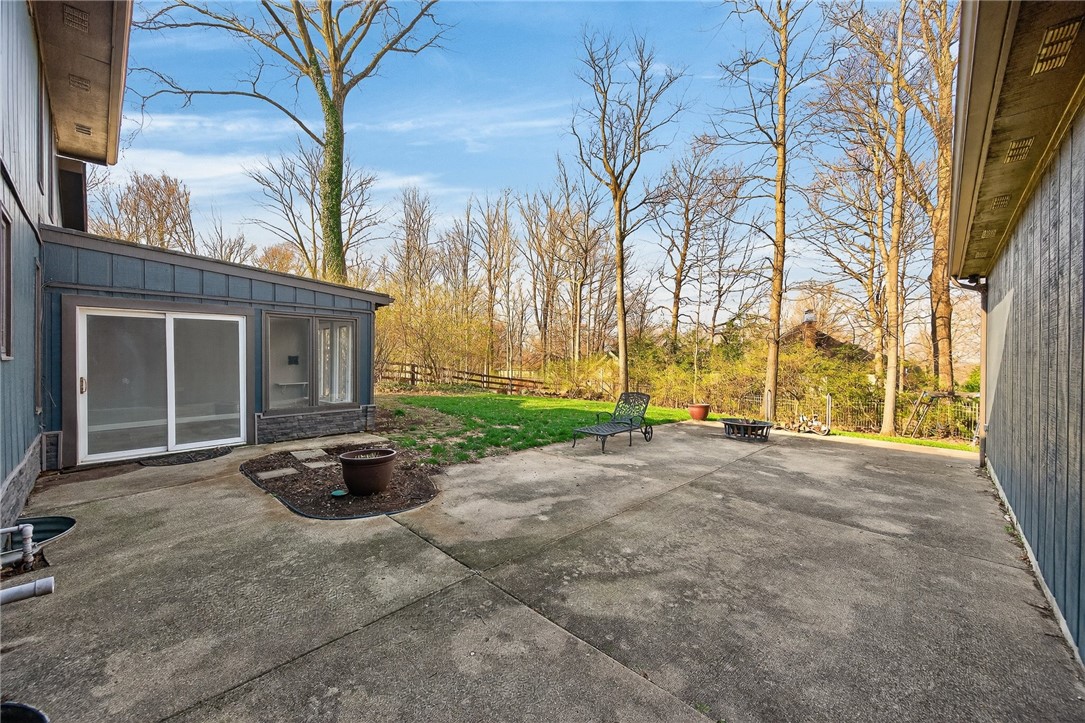 4747 Fawnwood Road Dayton, OH 45429 - Photo 51 of 58 This spacious patio offers an expansive area for outdoor enjoyment and direct access to a verdant yard.