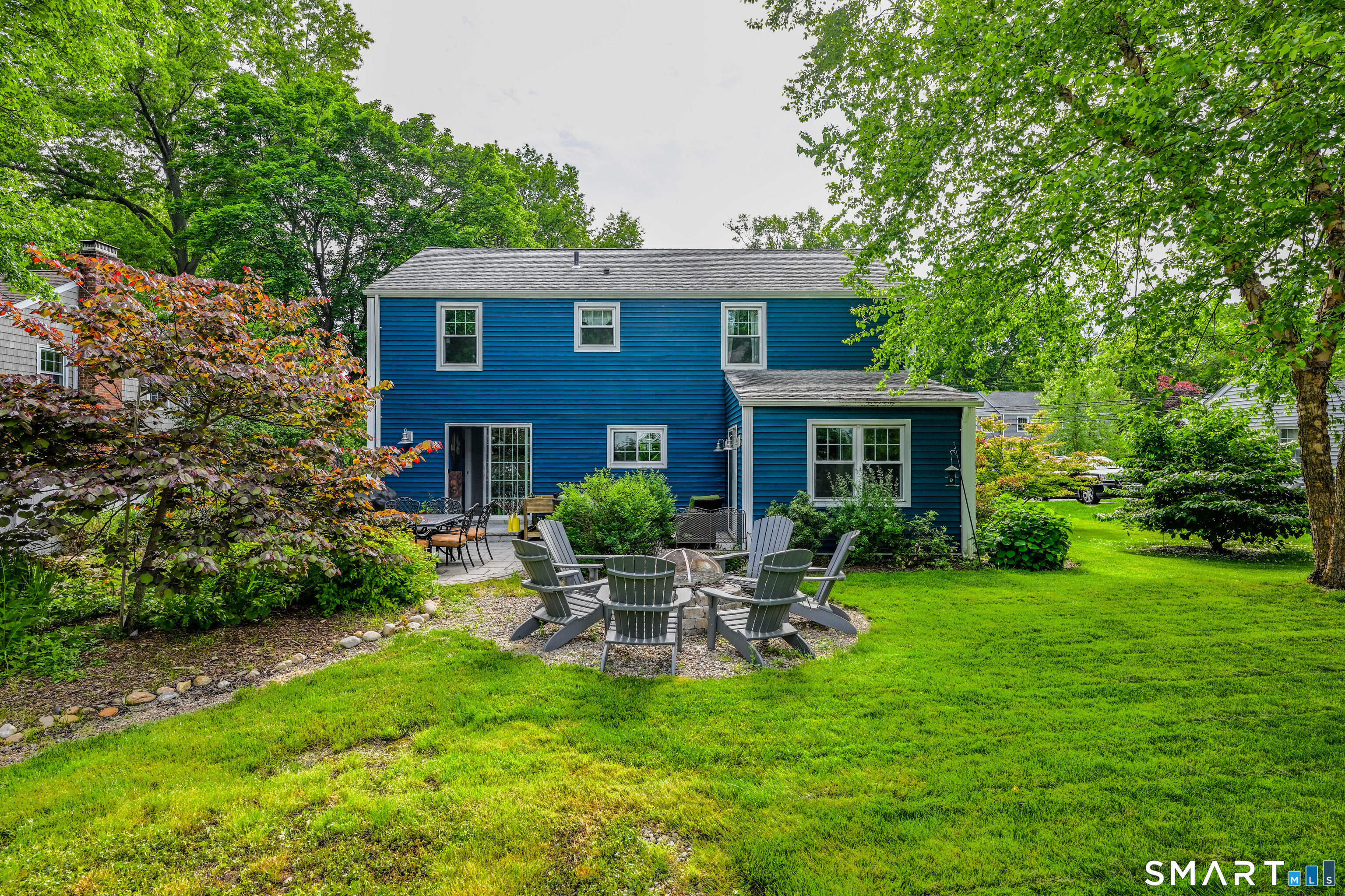 47 Spring Lane West Hartford, CT 06107 - Photo 36 of 38 a house view with a seating space and garden
