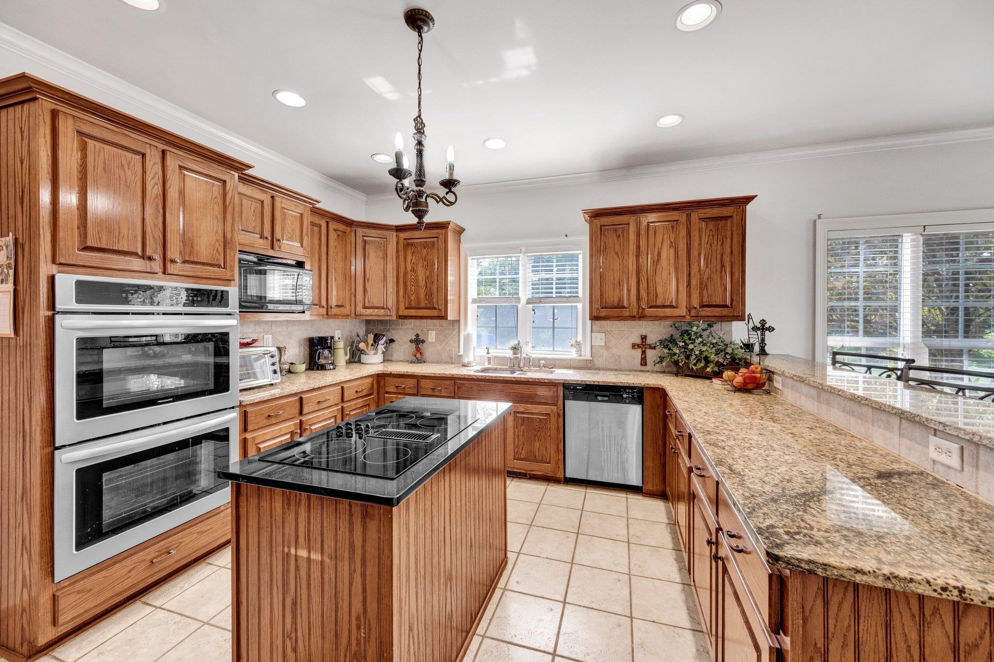 914 Beaver Creek Road Brighton, TN 38011 - Photo 17 of 39 a kitchen with stainless steel appliances granite countertop a stove sink and cabinets