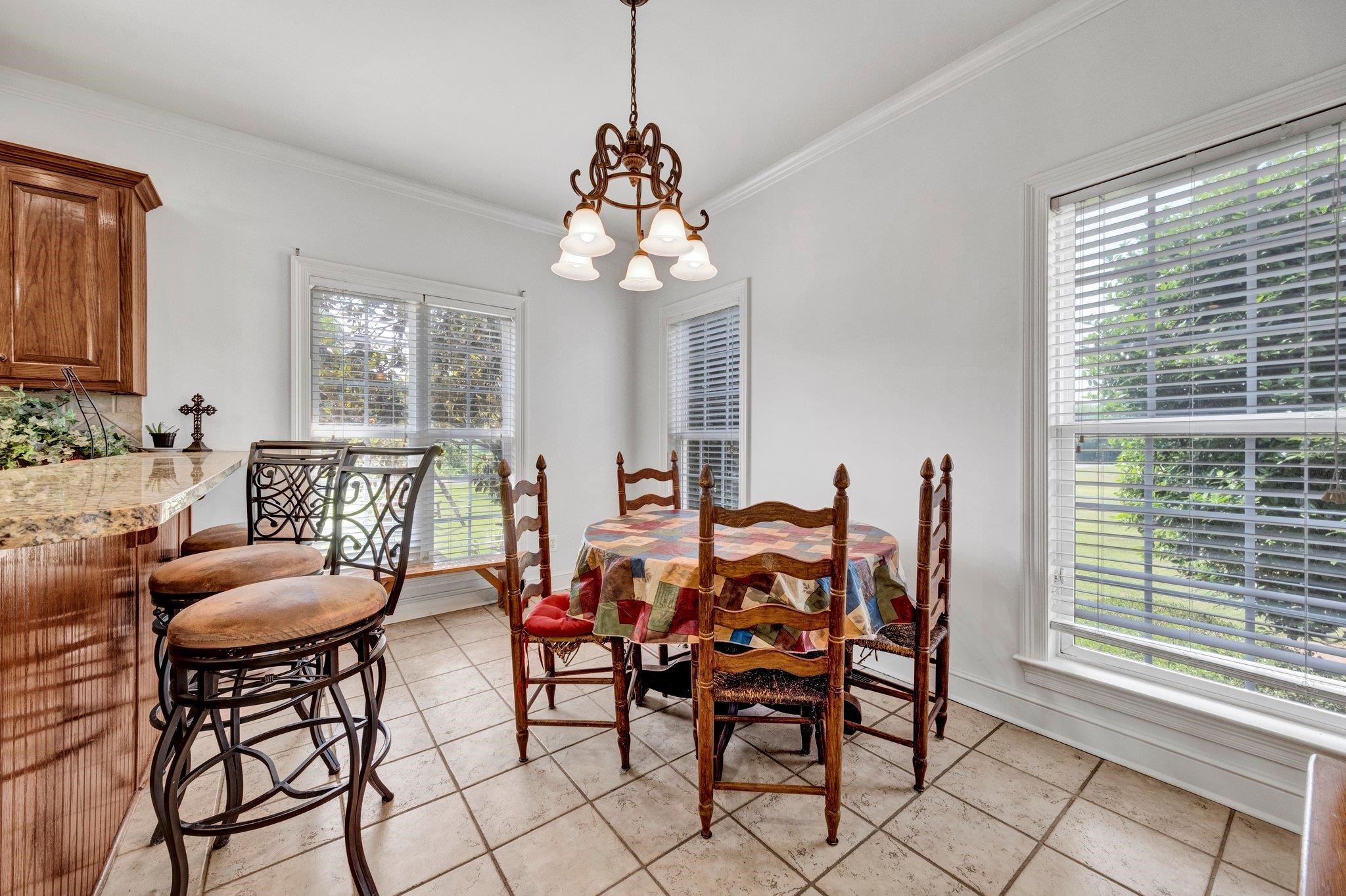 914 Beaver Creek Road Brighton, TN 38011 - Photo 19 of 39 a dining room with furniture a chandelier and window