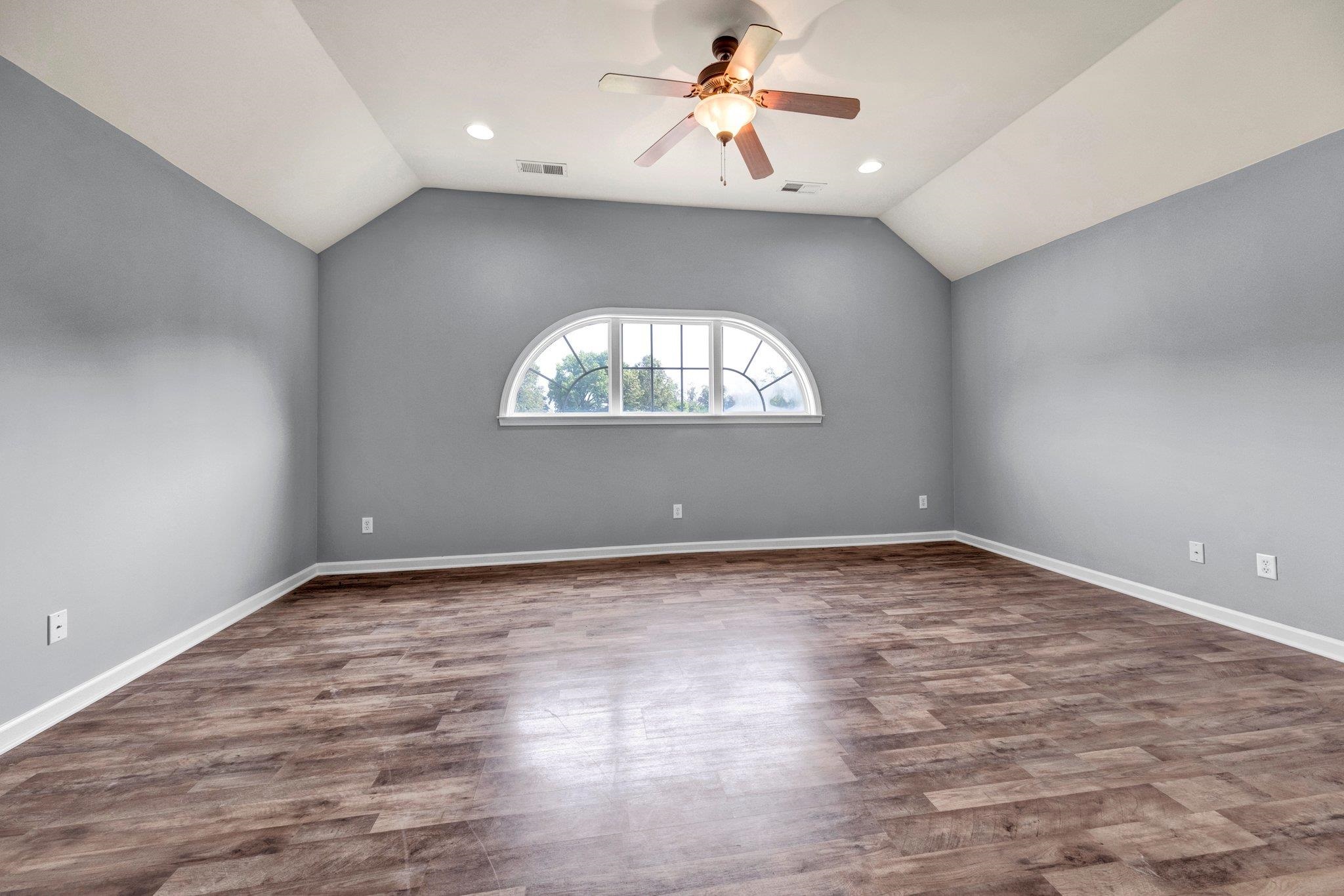 914 Beaver Creek Road Brighton, TN 38011 - Photo 21 of 39 an empty room with a window and a chandelier fan
