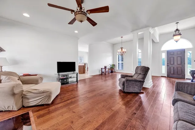 a living room with furniture and a flat screen tv