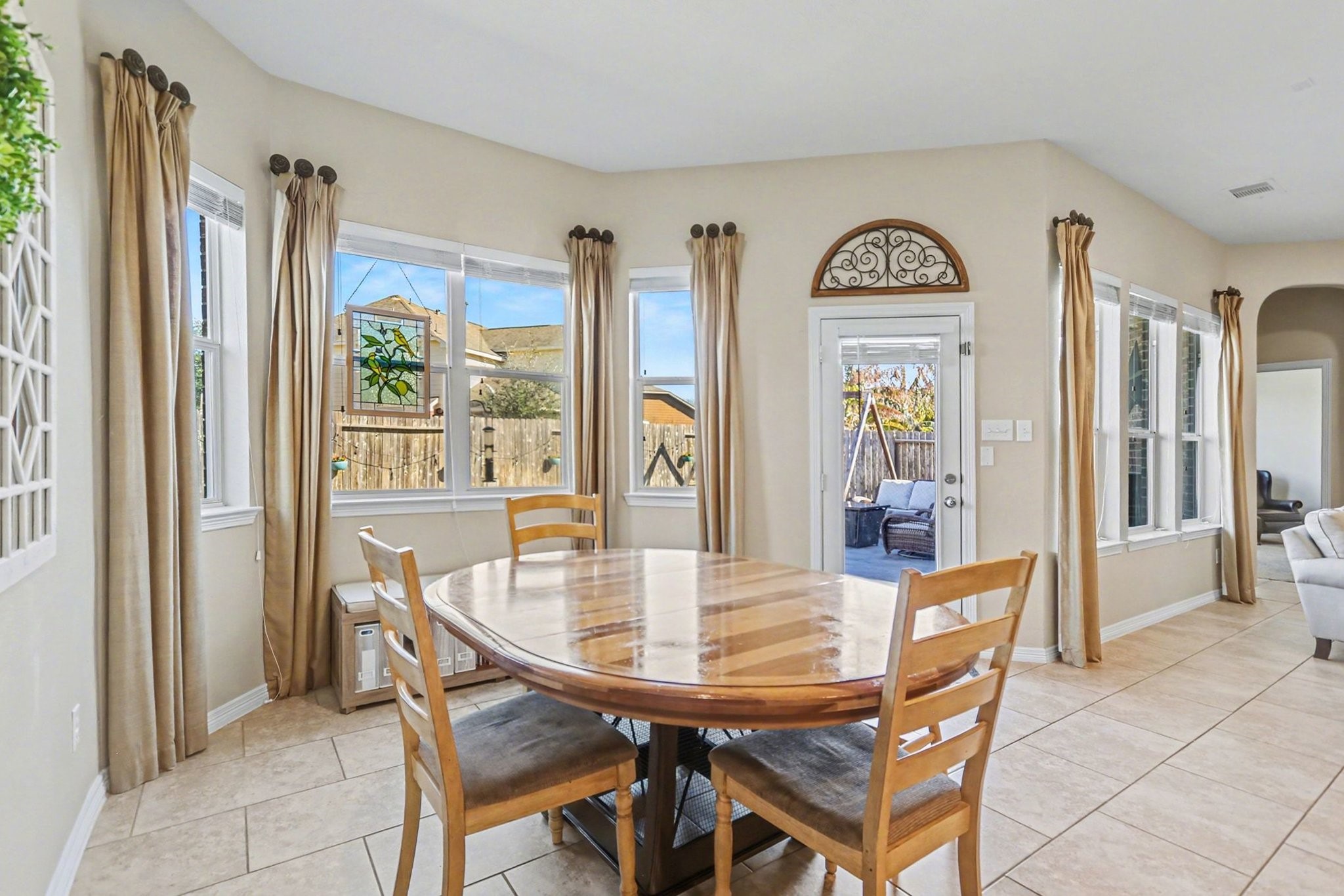 27006 Cliff Pointe Lane Katy, TX 77494 - Photo 14 of 34 Sun-filled breakfast nook surrounded by windows, offering the ideal spot for casual meals while overlooking the backyard.