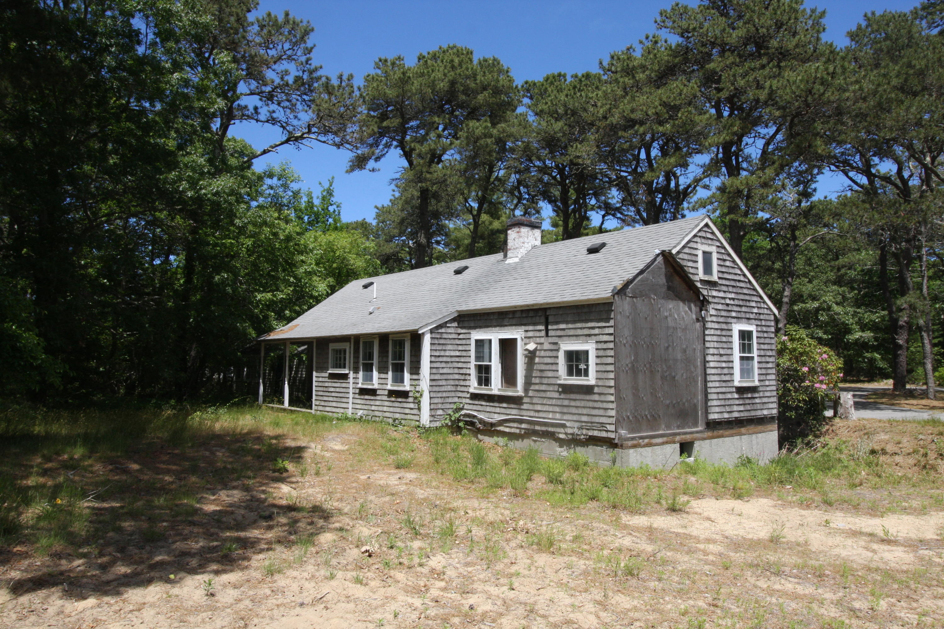 51 Paddocks Path Dennis, MA 02638 - Photo 16 of 22 a view of a house with a yard and large tree