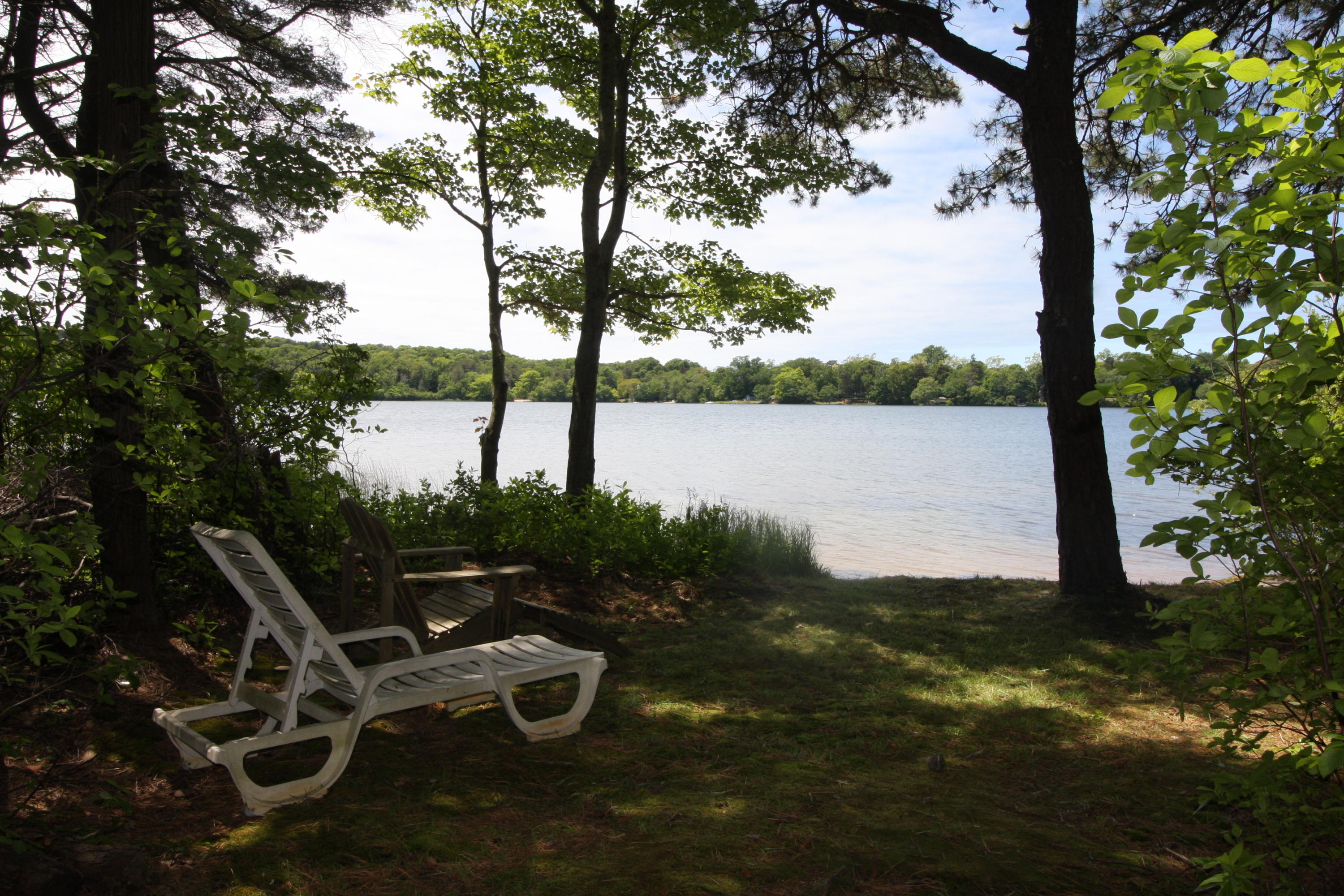 51 Paddocks Path Dennis, MA 02638 - Photo 18 of 22 a view of a lake with a mountain