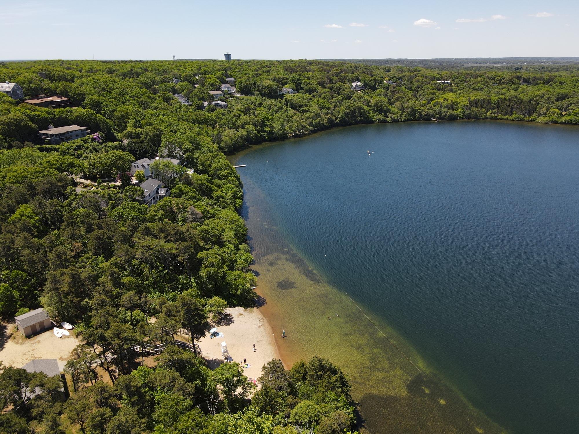 51 Paddocks Path Dennis, MA 02638 - Photo 9 of 22 a view of a lake with a city