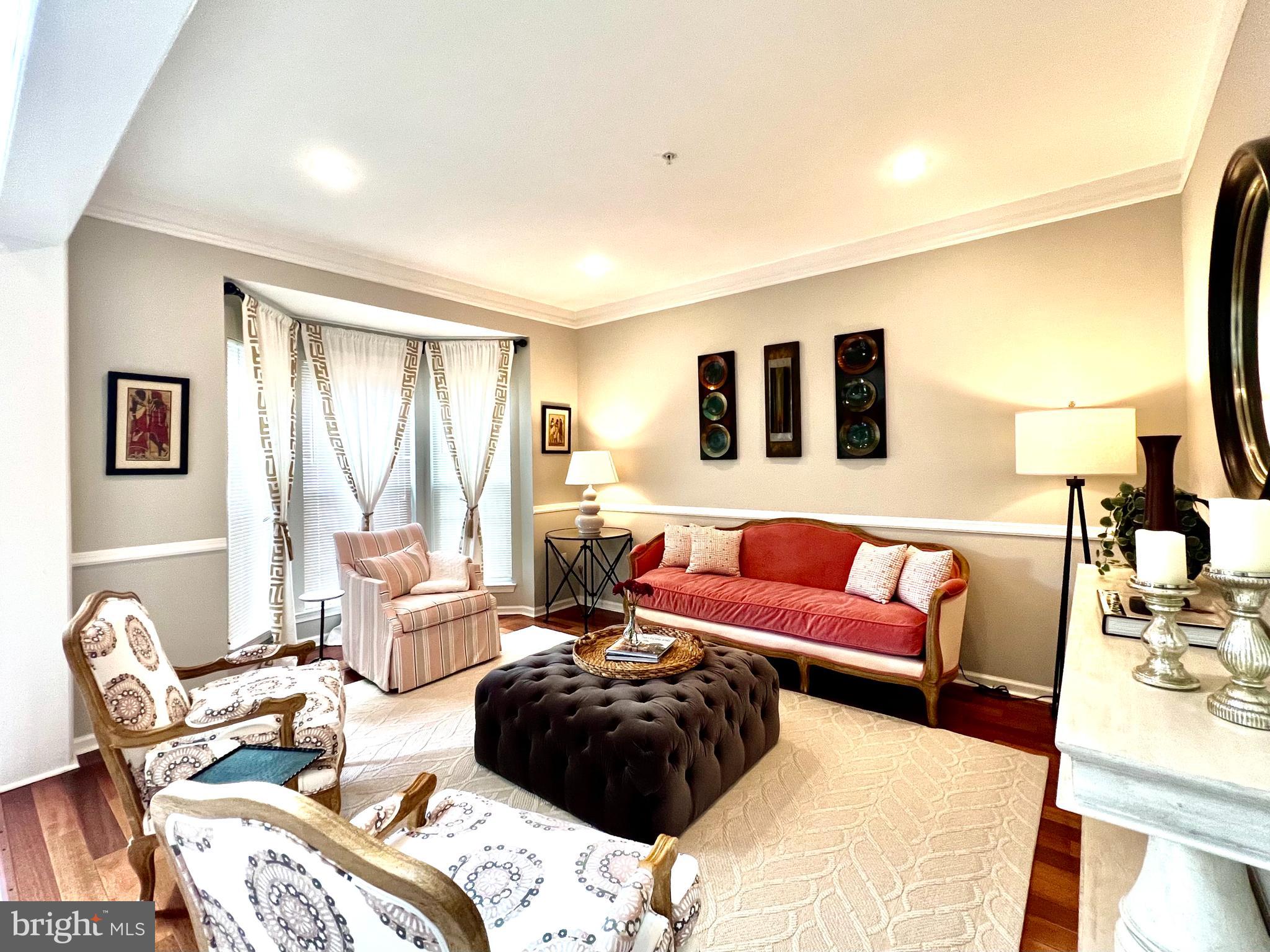 13501 Oaklands Manor Drive Laurel, MD 20708 - Photo 11 of 46 a living room with furniture and a large window