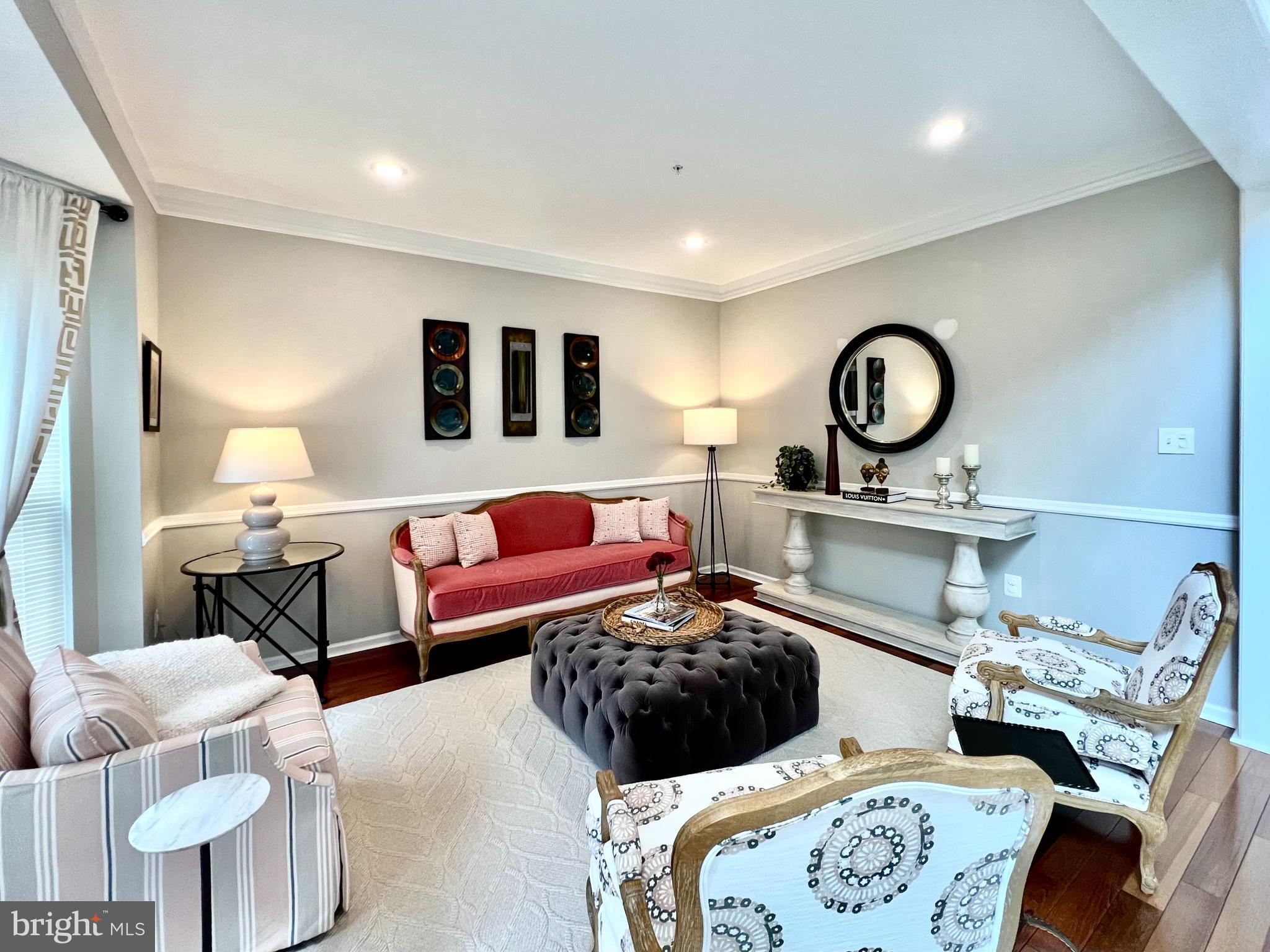 13501 Oaklands Manor Drive Laurel, MD 20708 - Photo 12 of 46 a living room with furniture and a large mirror