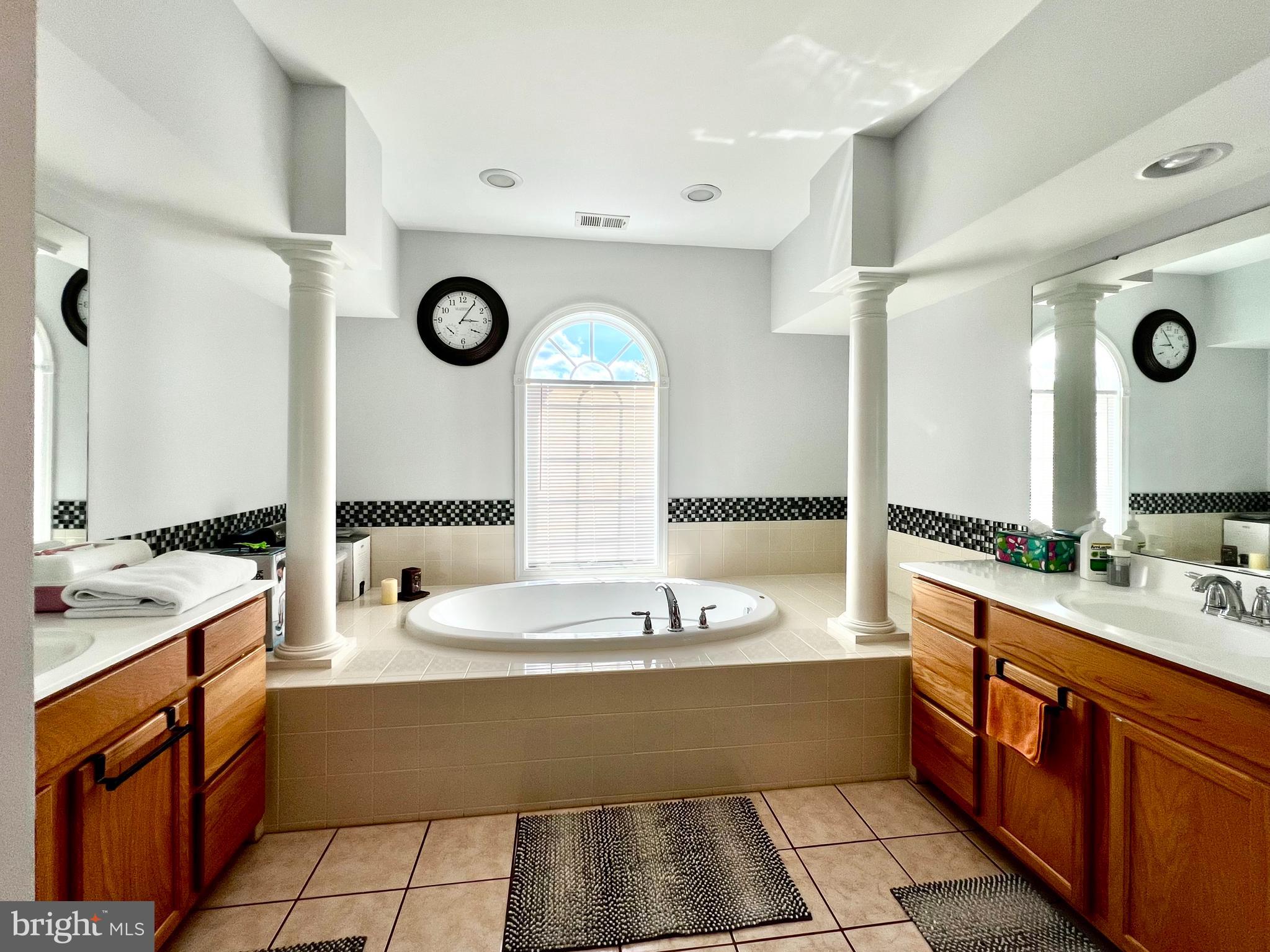 13501 Oaklands Manor Drive Laurel, MD 20708 - Photo 30 of 46 a large kitchen with a large counter top and sink