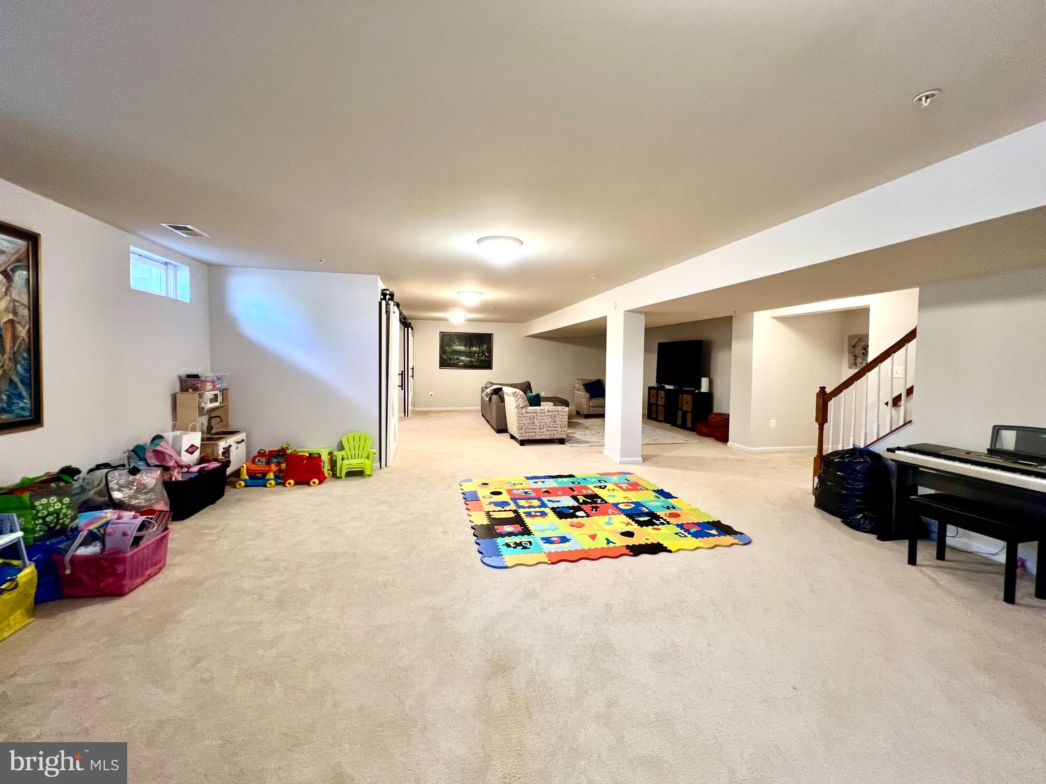 13501 Oaklands Manor Drive Laurel, MD 20708 - Photo 39 of 46 a living room with furniture and a table