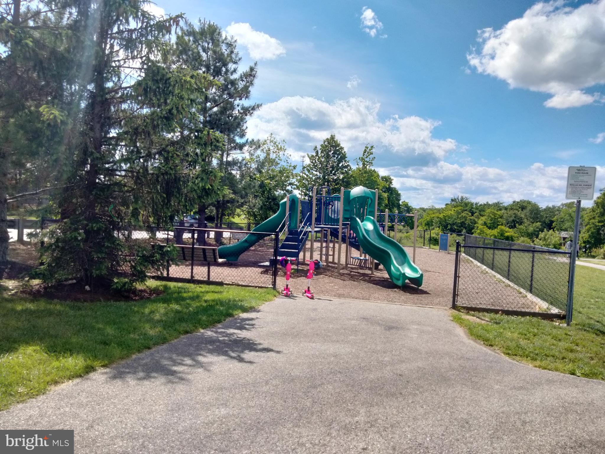 13501 Oaklands Manor Drive Laurel, MD 20708 - Photo 44 of 46 a view of outdoor space with playground and green space