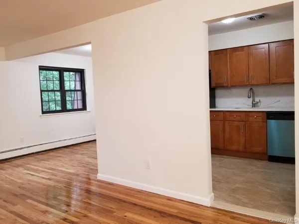 a view of a kitchen with a sink and a window